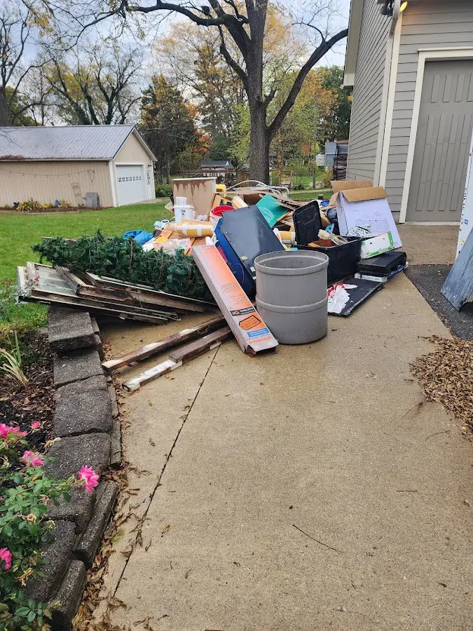 Dumpster being loaded with debris for Roofing Dumpster Rental in La Grange